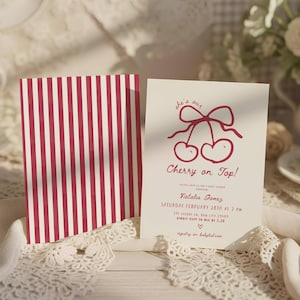 May include: Baby shower invitation with a red and white striped pattern on the back. The front displays a cherry illustration and the text "Cherry on Top!" with event details, including the name Natalia Gomez.