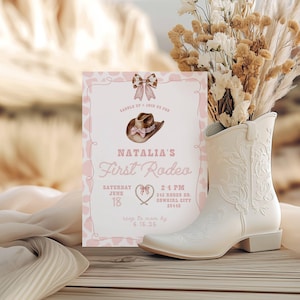 May include: Pink and white invitation with a cowboy hat and a lasso for a girl's first rodeo party. The invitation says "Natalia's First Rodeo" with the date and time of the event.