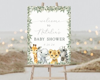 Puede incluir: Bienvenido a la Baby Shower de Natalia, cartel con un borde de hojas verdes y una ilustración de acuarela de una jirafa, un elefante, un león y una cebra. La fecha de la ducha es 8.26.24.