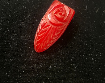 Wonderful cherry red carved Bakelite dress clip