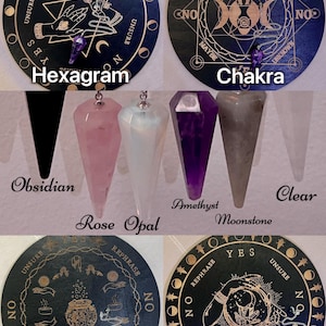 May include: A set of six divination boards with different designs, including a hexagram, chakra, potion, and globe. Each board is black with gold accents and features a pendulum. The boards are surrounded by six different colored crystal pendulums.