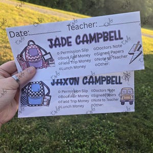 May include: Two school-themed forms, one for Jade Campbell and the other for Jaxon Campbell, are held up against a green background. Each form has a backpack graphic and checkboxes for school-related items like permission slips and lunch money.