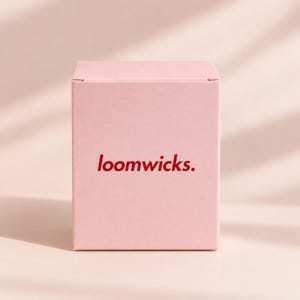 A pink box with the text "loompicks" printed on it.