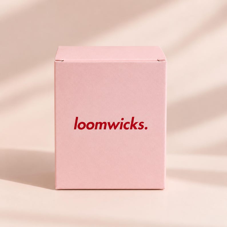 A pink box with the text "loompicks" printed on it.