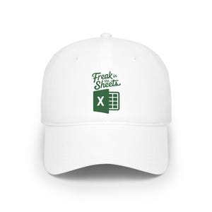 May include: A white baseball cap featuring a dark green graphic on the front. The graphic displays the text "Freak in the Sheets" in a stylized font above a green icon representing a spreadsheet application with the letter X inside.