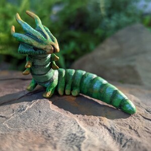 Dragon headed caterpillar, green dragon like creature, Nawab butterfly, made in Nova Scotia