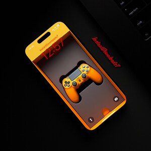 May include: A yellow and black video game controller in a yellow phone case with a digital clock displaying 12:57. The phone case has the text "InstantDownloads7" on the side.