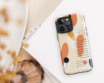 Pode incluir: Uma capa de telefone com um design abstrato com formas laranja, marrom e verde. A capa tem um fundo branco e detalhes pretos. A capa do telefone é projetada para um telefone com uma lente de câmera tripla.