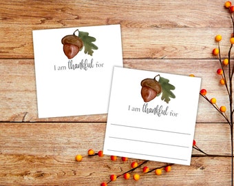 May include: Two white cards with a watercolor illustration of an acorn and the text "I am thankful for".