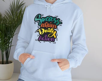 Sudadera motivacional unisex: "El éxito requiere acción diaria".