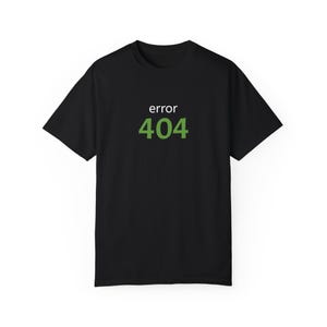 May include: Black t-shirt with the text "error 404" in white and green.