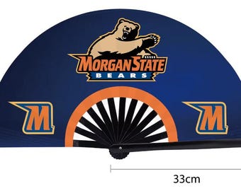 May include: A navy blue hand fan featuring the Morgan State Bears logo with a bear graphic and the text "Morgan State Bears". The fan has an orange and black design and measures 33cm in length.
