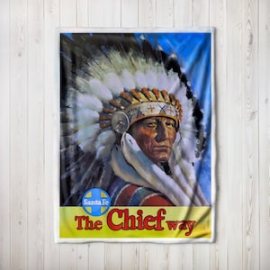 May include: A vintage travel poster featuring a Native American chief wearing a colorful headdress. The poster has a blue background with white clouds and the text "The Chief way" in yellow and black letters. The Santa Fe logo is in the bottom left corner.