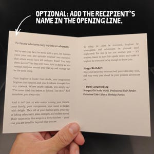 May include: A folded greeting card with printed text. The card's message is a birthday wish, with a quote from Pippi Longstocking. The card is held by a person's hand.