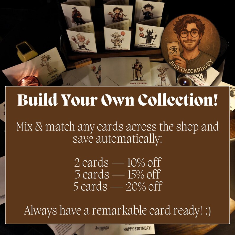 May include: A collection of illustrated greeting cards featuring various characters and themes, displayed in a wooden container. The cards have text that reads "Build Your Own Collection!" and "Happy Birthday!"