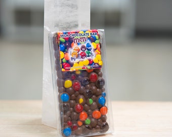 Milk chocolate bar with assorted colorful chocolate mini candies