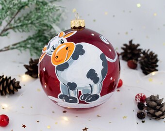 Glass Christmas tree toy ball “Cow on red” 10 cm