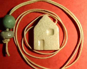 Ceramic house pendant, white cord