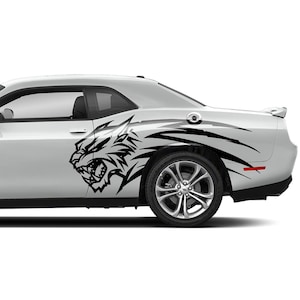 May include: A white coupe featuring a black tiger graphic on its side. The car has silver alloy wheels and a streamlined design. The tiger graphic is a detailed, stylised illustration.
