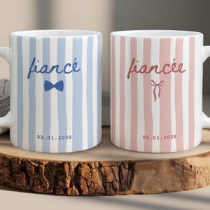 Personalized fiancé and fiancée striped mug set in dusty blue and blush pink with custom wedding date