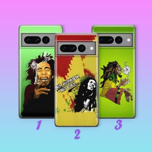 May include: Three phone cases with different designs featuring Bob Marley. The first case has a black and white image of Bob Marley smoking a cigarette. The second case has a yellow background with a black and white image of Bob Marley and the text "No Woman, No Cry". The third case has a green background with a cartoon image of Bob Marley smoking a cigarette.