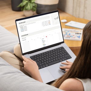 mock up of a girl on her laptop with the notion template, adhd mock up
