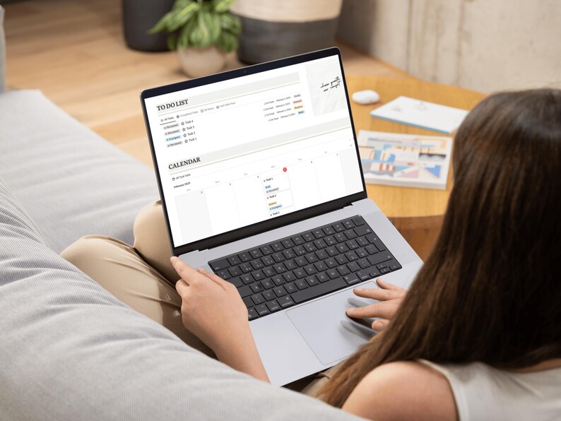 mock up of a girl on her laptop with the notion template, adhd mock up