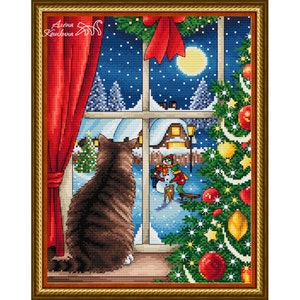 May include: Cross-stitch picture of a cat gazing out of a window at a snowy winter scene. A decorated Christmas tree and red curtain frame the view. The scene includes a snowman, a full moon, and a cosy house.