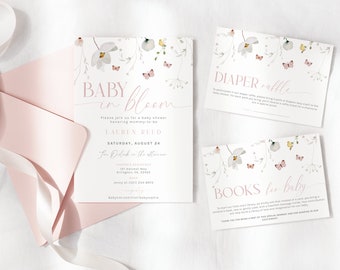 May include: A set of three baby shower cards with a floral design. The invitation card says "Baby in Bloom" and includes the date, time, and location of the shower. The diaper raffle card says "Diaper Raffle" and the book request card says "Books for Baby".