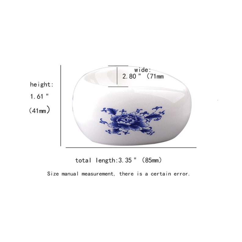 May include: White ceramic dish with a blue floral design. The dish is 3.35 inches long, 2.80 inches wide, and 1.61 inches high.