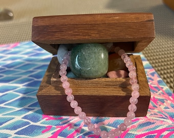 Wooden treasure box full of mystery crystals