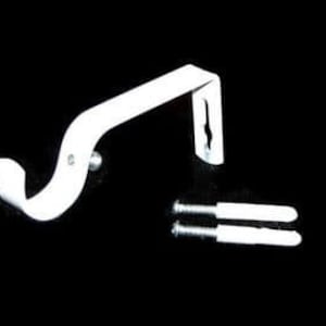May include: White metal curtain rod bracket with two screws. The bracket is designed to hold a curtain rod.