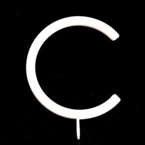 May include: White plastic letter C, shaped like a circle with a small stem at the bottom.