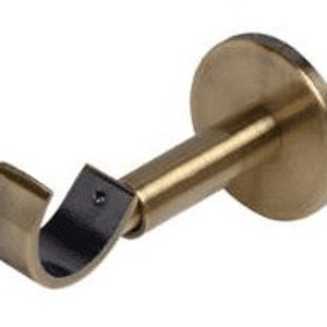 May include: A gold-toned metal curtain rod bracket with a curved arm and a round base.