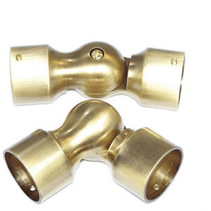 May include: Two brass adjustable pipe fittings with a ball joint. The fittings are designed to connect two pipes at an angle.