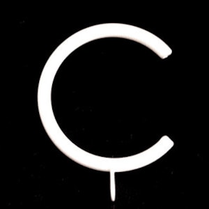 May include: White plastic letter C, shaped like a circle with a small stem at the bottom.