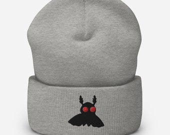 May include: Grey beanie with a black embroidered moth with red eyes.
