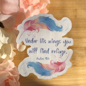 May include: A white sticker with a watercolor design of two colorful feathers. The sticker has the text "Under His wings you will find refuge. Psalms 91:4" in purple.