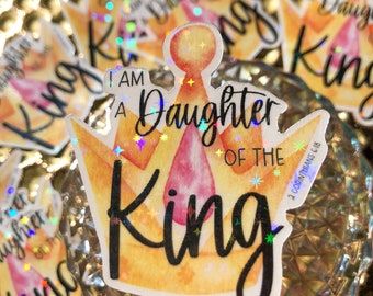 May include: A yellow and pink crown with glitter and the text "I am a Daughter of the King" and a bible verse, 2 Corinthians 6:18.