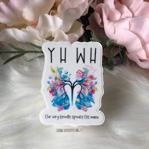May include: White sticker with a floral design of lungs and the text "YHW" and "Our very breath speaks His name".