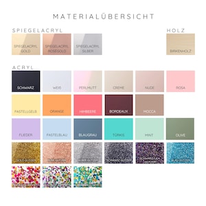 May include: A German-language colour chart, titled "MATERIAL&Uuml;BERSICHT", presents a range of acrylic and wood colours. The chart includes metallic, glitter, and solid colours, such as gold, silver, black, white, pink, and blue.