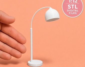 May include: A white miniature desk lamp with a curved neck and a dome-shaped shade, featuring a circular base. A circular graphic in the corner displays the text 1:12 STL DIGITAL FILES, indicating this is a 3D printable model for dollhouses.