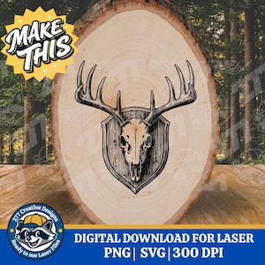May include: A digital design for laser cutting featuring a deer skull with antlers mounted on a shield-shaped plaque. The design is set against a wood slice background. The image includes the text "MAKE THIS" and "DIGITAL DOWNLOAD FOR LASER".