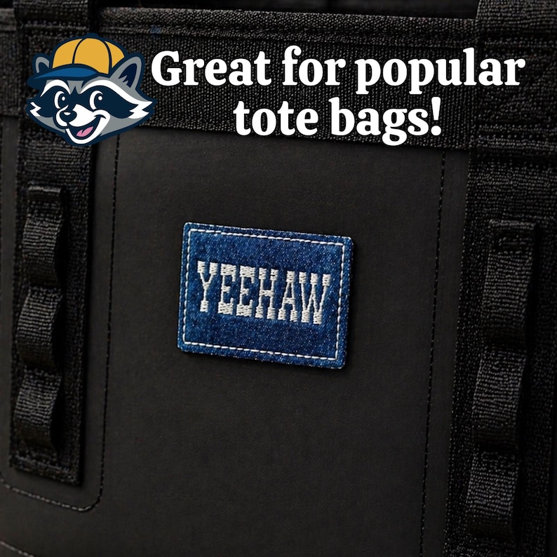 A denim patch with the word YEEHAW embroidered with an offwhite thread and outer stitching on a popular tote bag attached with hook and loop backer.