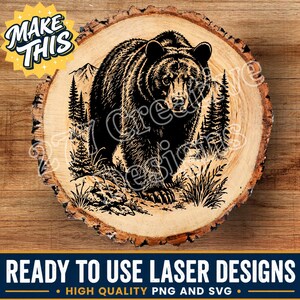 May include: A circular wood slice featuring a black laser-engraved illustration of a grizzly bear standing in a forest with mountains in the background. The design includes a yellow starburst graphic with the text MAKE THIS in the upper left corner.