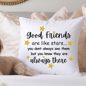 May include: White throw pillow with the text "Good Friends are like stars... you don't always see them but you know they are always there" in black text with gold stars.