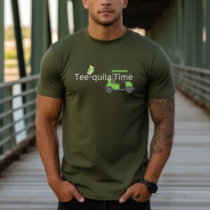 May include: A green t-shirt with a golf cart and a shot glass graphic. The text on the shirt reads "Tee-quila Time".