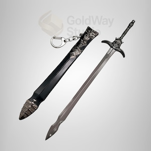 May include: A black sword with a silver hilt and a black leather scabbard with a silver design. The sword has a key chain attached to the scabbard.
