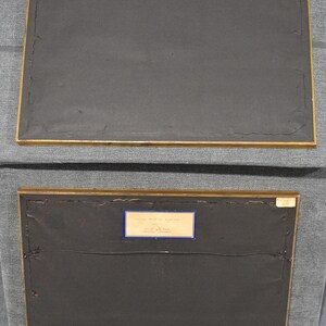 May include: Two framed black and white prints with labels on the back. The top label reads "Krapp's", and the bottom label reads "Battle Ground at Antietam, 1776, James Mc.Pherson, American History".