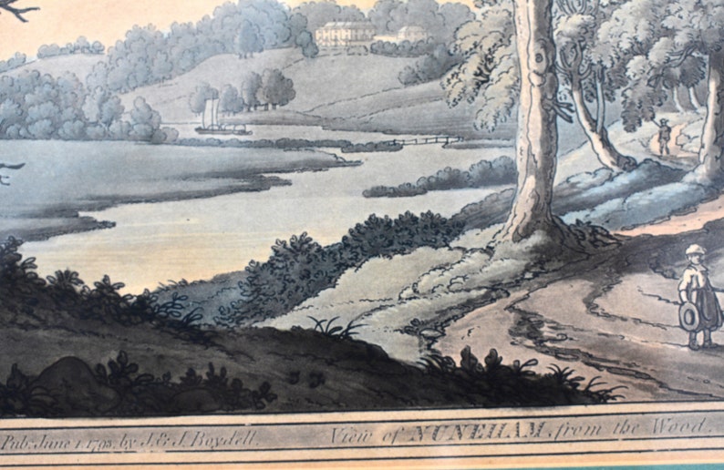 May include: An antique print depicting a view of Nunham from the woods. The print is in black and white with hand-painted watercolor accents. The image shows a river winding through a wooded landscape with a house in the distance.